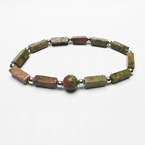Detail of natural green and brown rectangle stone beads bracelet with silver spacers