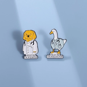 Cartoon dog and duck enamel pins featuring cute doctor designs on a light blue background