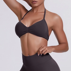 Detail of ribbed knit halter sports bra and high-waist leggings in charcoal grey