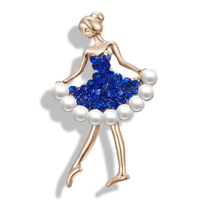 Detailed view of ballet dancer brooch with blue rhinestones and pearl embellishments