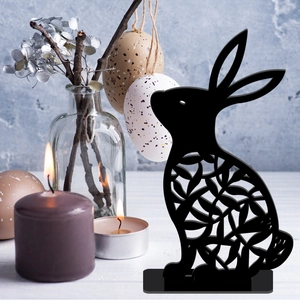 Easter bunny silhouette decor with floral hollow cutouts on a rustic table setting