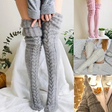 Detail view of cotton crew socks in grey, pink, and white on model for a trendy look