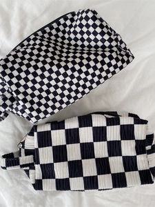 Nordic style black and white checkered velvet makeup bag with textured bubble fabric