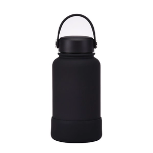 Detail of black matte stainless steel water bottle with silicone base and carry handle