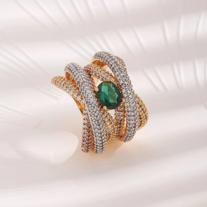Elegant multi-layer gold ring featuring an oval green zircon and micro-paved crystals