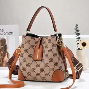 Retro monogram bucket bag with dual shoulder straps and brown leather details for women