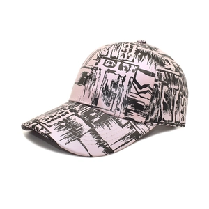 Detail of pink baseball cap with black graffiti print and classic six-panel structure