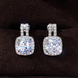 Minimalist cushion cut halo stud earrings with cubic zirconia in silver-toned finish
