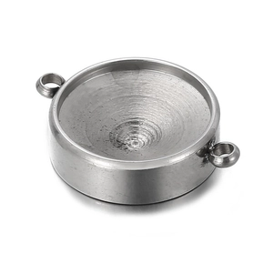 Macro view of silver stainless steel birthstone tray pendant with dual side rings
