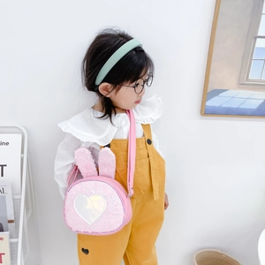 Sparkly pink rabbit ear girls crossbody bag with sequins and silver heart detail