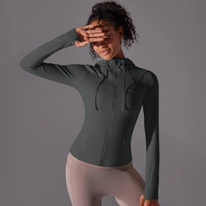 Detail of slim-fit hooded sports jacket with thumbholes and smooth zipper closure