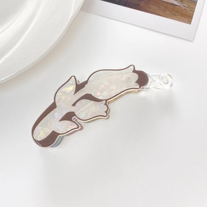 Detail of iridescent mother of pearl hair clip with brown edges and clear banana clamp