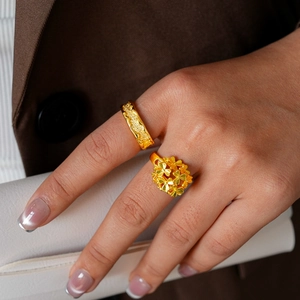 24k gold-plated floral and textured open rings on model with elegant styling