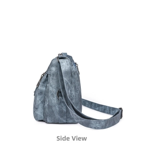 Side view of retro washed denim crossbody bag with bronze hardware and detailed stitching