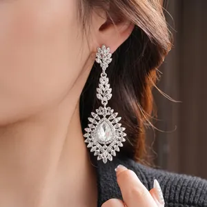 Elegant silver needle drop earrings with pear-shaped stones and laurel leaf crystal design