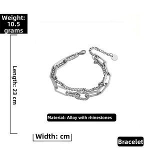 Detail view of silver layered chain bracelet with rhinestone links weighing 10.5g and 23cm long