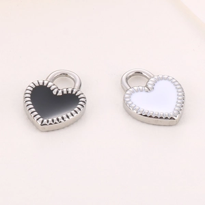 Polished stainless steel heart lock pendants in black and white enamel for jewelry making