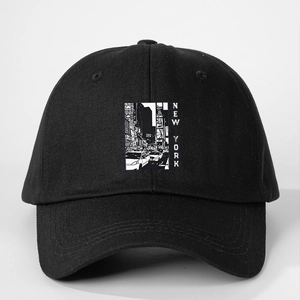 Detail of black cotton baseball cap showing New York City street photography print and text
