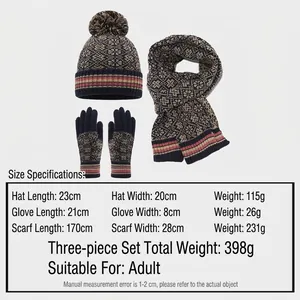 Navy blue winter set with jacquard snowflake patterns including beanie, scarf, and gloves