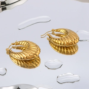 U-shaped 18K gold plated stainless steel hoop earrings with elegant spiral texture