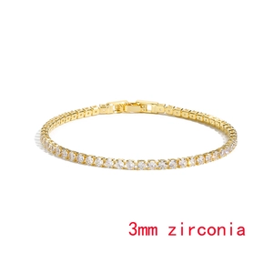 Detail showing a 3mm white zirconia tennis bracelet in a gold plated claw setting