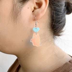 Ghost drop earrings featuring blue hearts and translucent orange gradient dangles