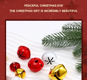 Christmas metal bells in red, gold, and white displayed with festive green pine branches