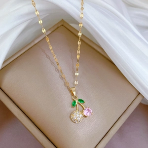 Elegant cherry pendant necklace with pink zircon and clear crystals on golden chain