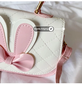 Detail showing high-gloss patent leather with diamond quilting and sturdy edging