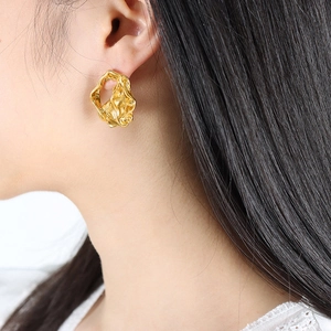 Minimalist gold irregular lava textured stud earrings with abstract liquid metal design