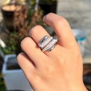 Macro view of multi-layer silver crown ring with white cubic zirconia pavé stones