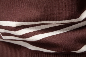 Close-up of brown and cream striped knit fabric with ribbed hem detail for men