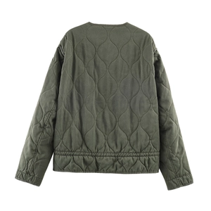Deep green quilted jacket with wave patterns and elastic hem on a clean white background