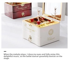 Close-up of ballet music box with dancing girl figurine and classic storage mirror