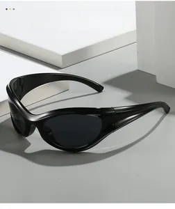 Detail of black Y2K sports wraparound sunglasses with a sleek polished frame and shield lens