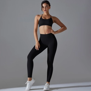 Detail of high-waist black seamless yoga set with breathable fabric and slim fit design