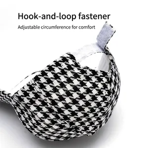Classic houndstooth baseball cap featuring an adjustable Velcro strap closure for comfort