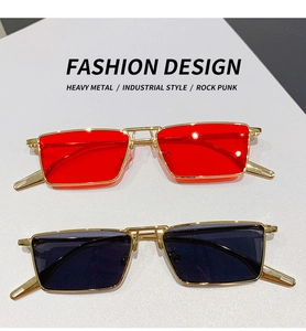 Detail of heavy metal punk sunglasses with gold frames in red and black lenses