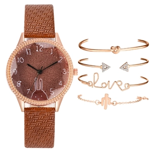 Close-up of rabbit dial watch set with rose gold knot and love bracelets and cactus jewelry