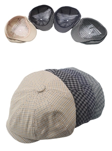 Detail view of four plaid beret hats showing inner lining and classic checkered patterns