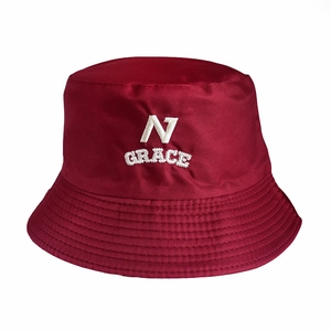 Detail of burgundy bucket hat featuring white alphabet embroidery on canvas fabric