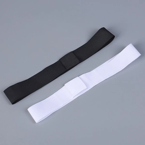 Detail of adjustable elastic hat chin straps in black and white for straw sun hats