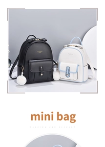 Close-up of mini leather backpacks in black and white with gold zippers and fur ball charms
