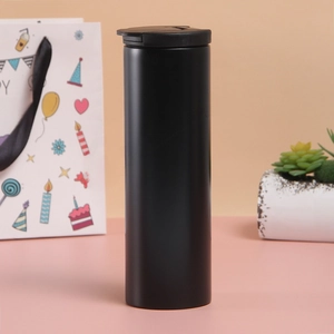 Close-up of matte black stainless steel vacuum flask with a flip-top lid and sleek body