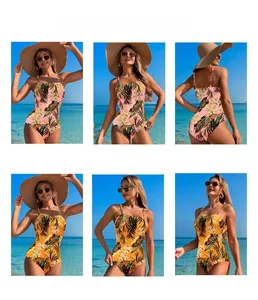 Detail of one-piece swimwear featuring pink and yellow tropical palm leaf prints