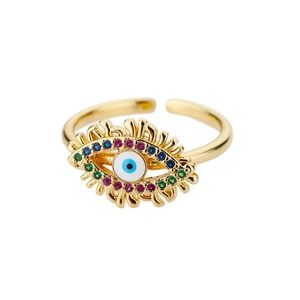 Macro detail of golden evil eye ring with colorful zircon stones and adjustable band
