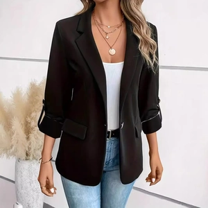 Women's black blazer with rolled sleeves and lapel collar, styled for autumn fashion look