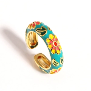 Detail view of golden adjustable ring featuring colorful enamel five-petal flower motifs