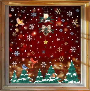 Detailed Christmas window stickers showing white snowflakes and colorful birds on glass