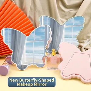 Tabletop butterfly makeup mirror with irregular plastic frame and foldable back stand